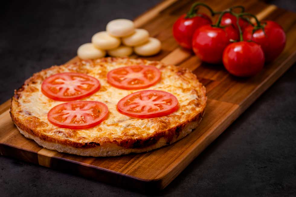 Classic Pizza With Ham and Fresh Tomato in Royal Pizza Menu